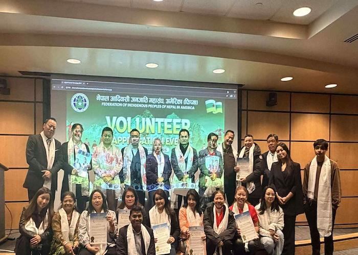 Group of individuals posing for a photo at a volunteer appreciation event organized by the Federation of Indigenous Peoples of Nepal America.